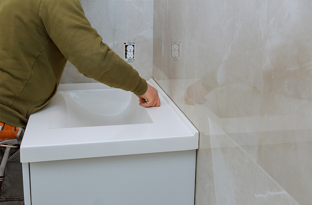 Installing a new vanity during a small bathroom remodel in Rhode Island