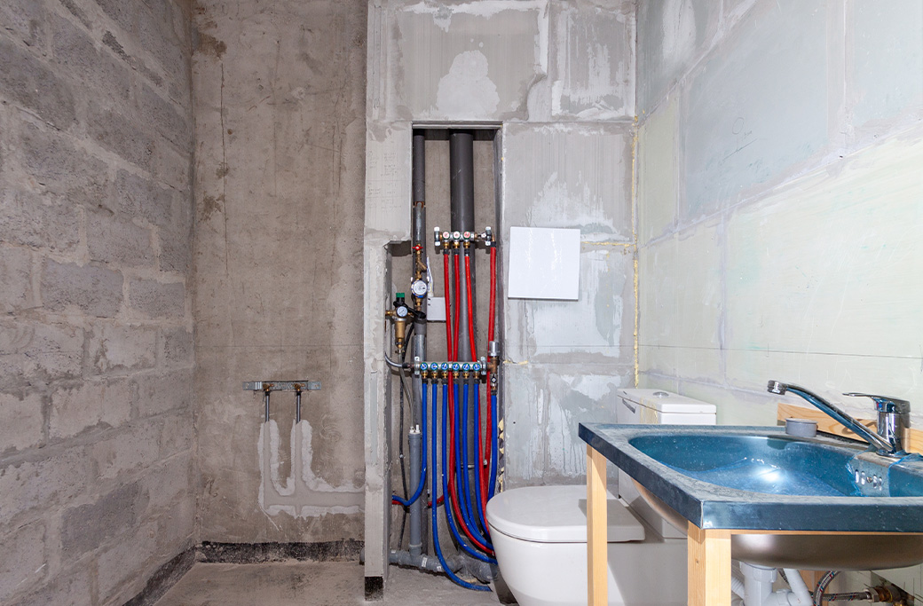 Plumbing and electrical upgrades during a small bathroom renovation in Rhode Island
