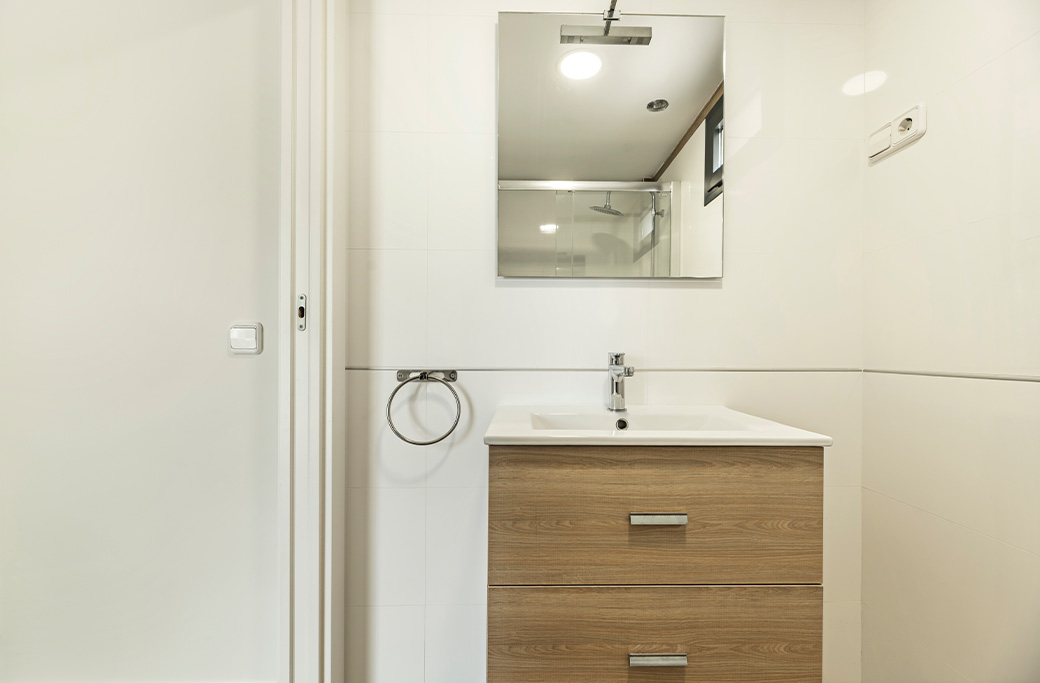 Compact bathroom vanity designed for a small Rhode Island bathroom