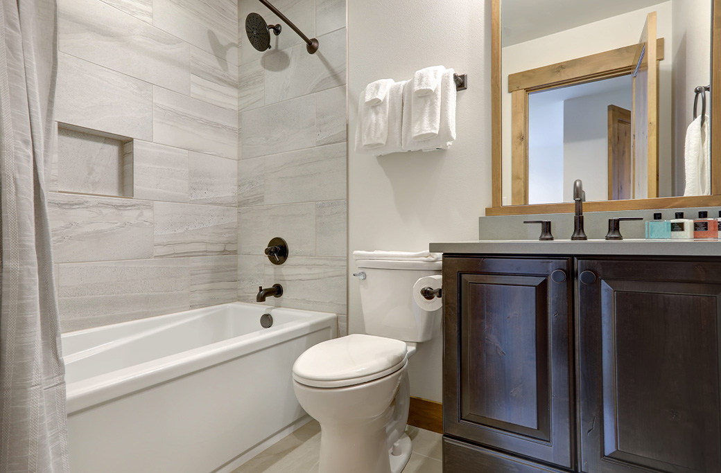 Traditional bathroom design with classic tile and modern fixtures in a Rhode Island home
