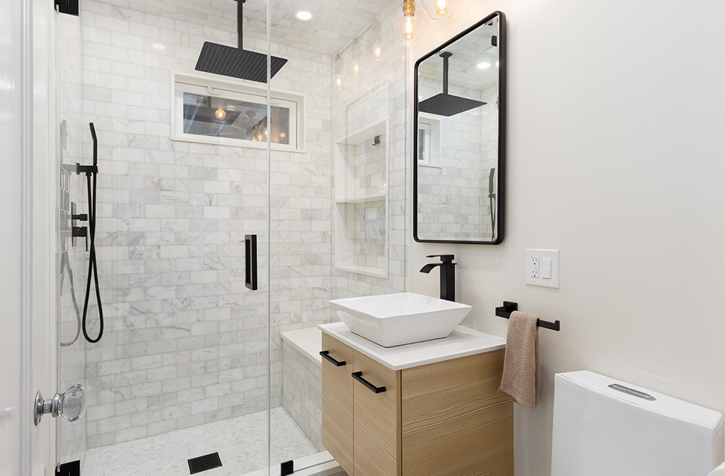 Classic bathroom tile design in an older Rhode Island home renovation. Custom shower niche with coordinating bathroom tile and grout