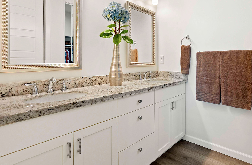 Custom bathroom vanity with quartz countertop installed during a Cranston RI bathroom remodel