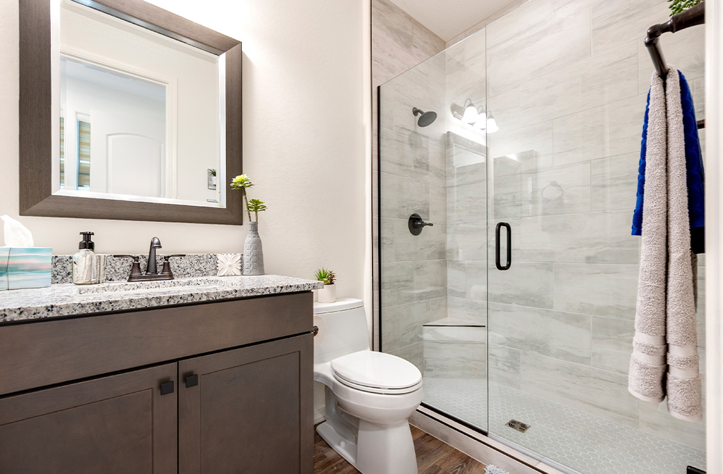 Bathroom renovation in a Rhode Island home with updated tile, vanity, and modern fixtures