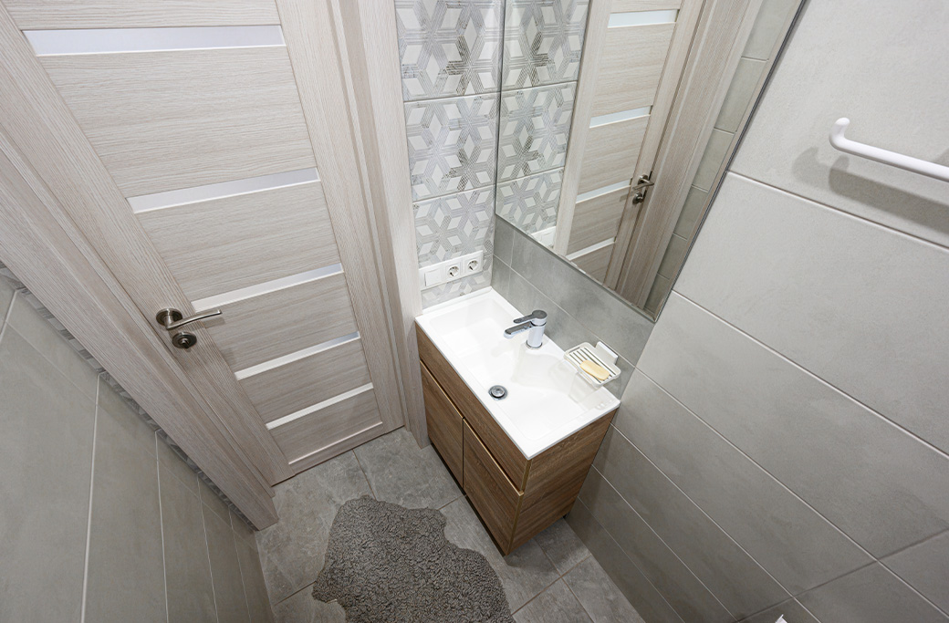 Small bathroom remodel with space-saving vanity and walk-in shower