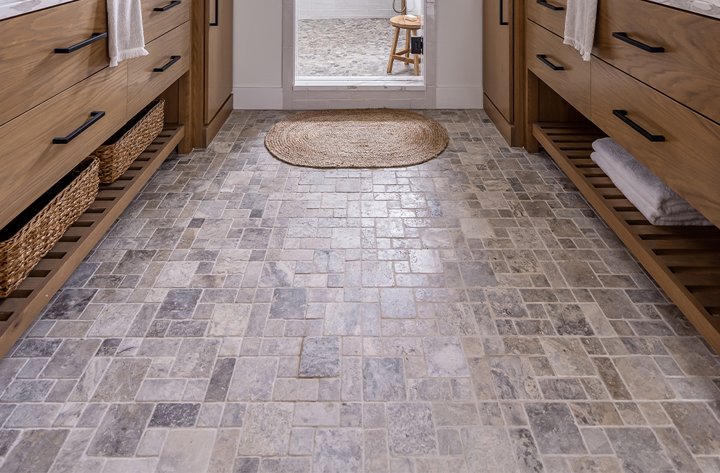 Bathroom vanity and coordinating floor tile in a completed Rhode Island remodel