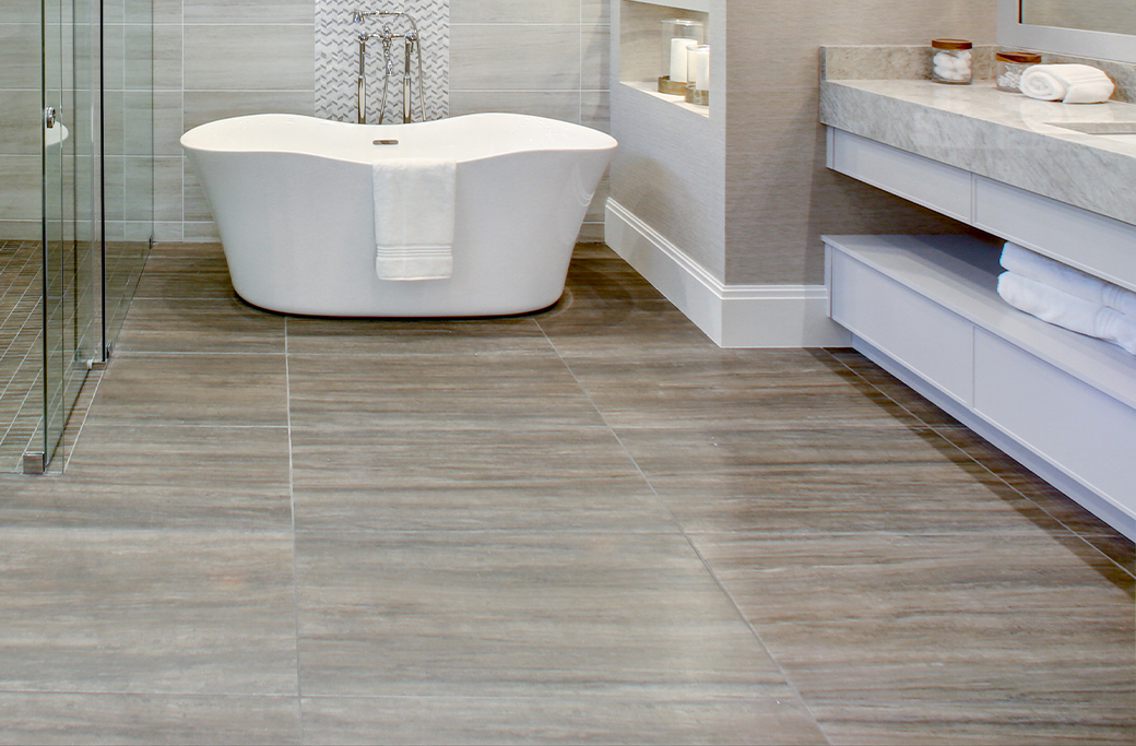 Wood-look porcelain flooring in a remodeled Rhode Island bathroom