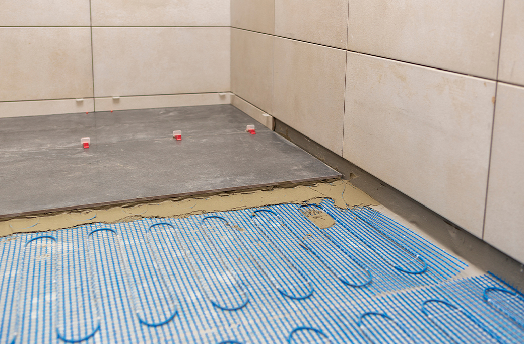 Radiant floor heating installed beneath bathroom tile in a Rhode Island remodel