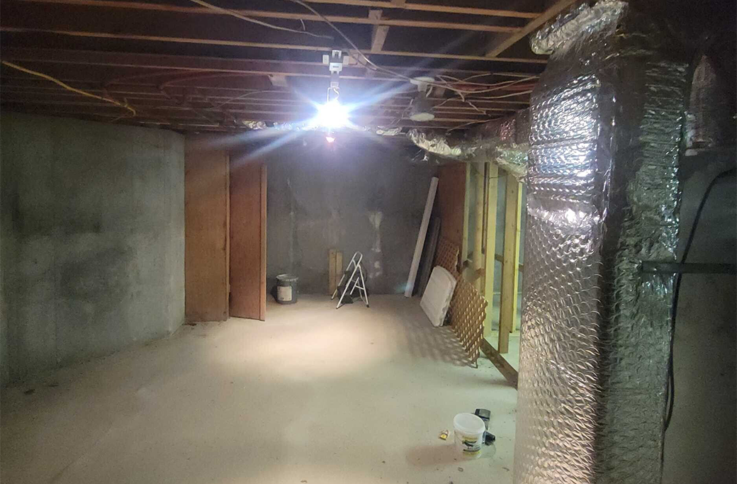 Unfinished basement before remodeling